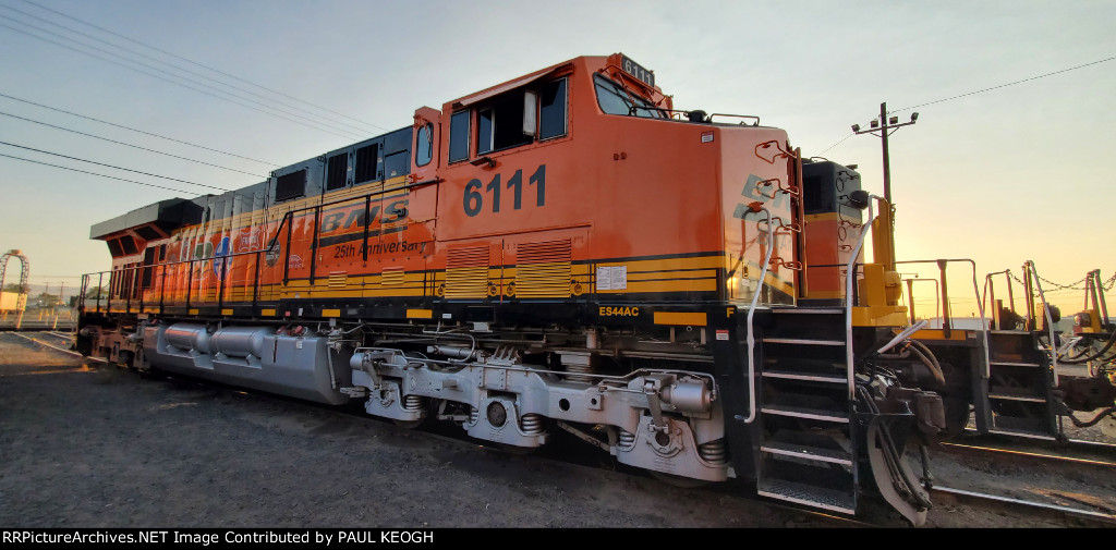 BNSF 6111 in The Shadows of The Setting Sun Shows Off Her 25th BNSF Anniversary Paint Scheme. 